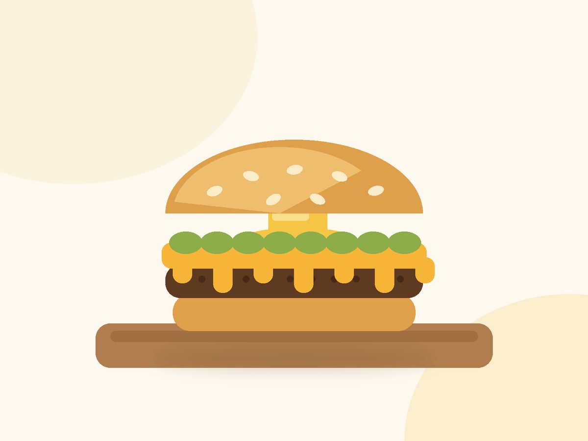 Butter Burger mit geröstetem, gebuttertem Brioche-Bun, schmelzendem Käse und saftigem Patty auf einem Holzbrett